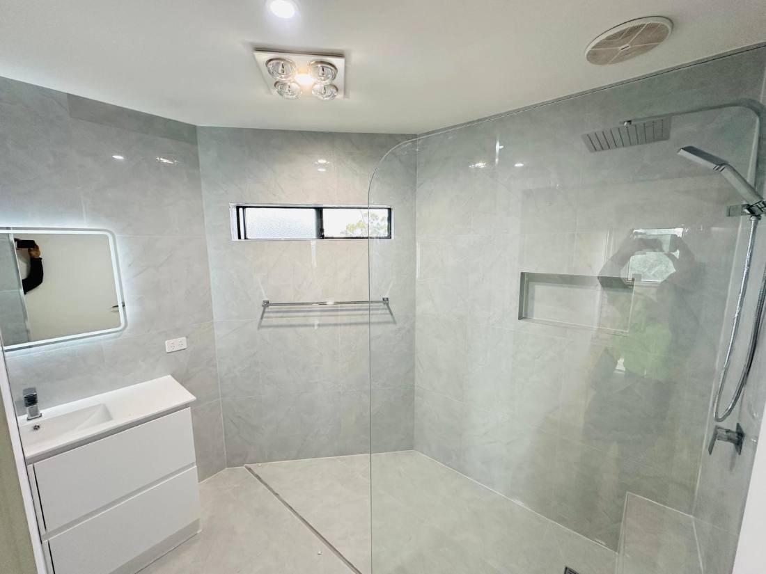 Renovated bathroom with a new freestanding bath, shower and vanity